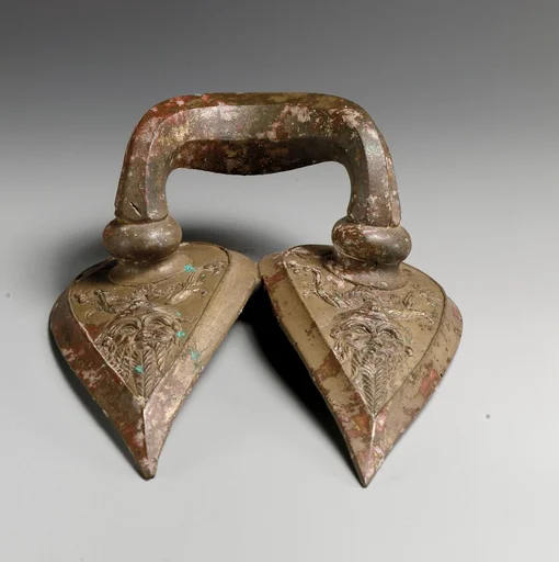 Bronze handle of a vessel with Silenos mask