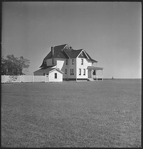 [29 Exterior Views of Midwestern Victorian House in Field]