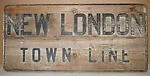 [Stenciled Sign: "New London Town Line"]