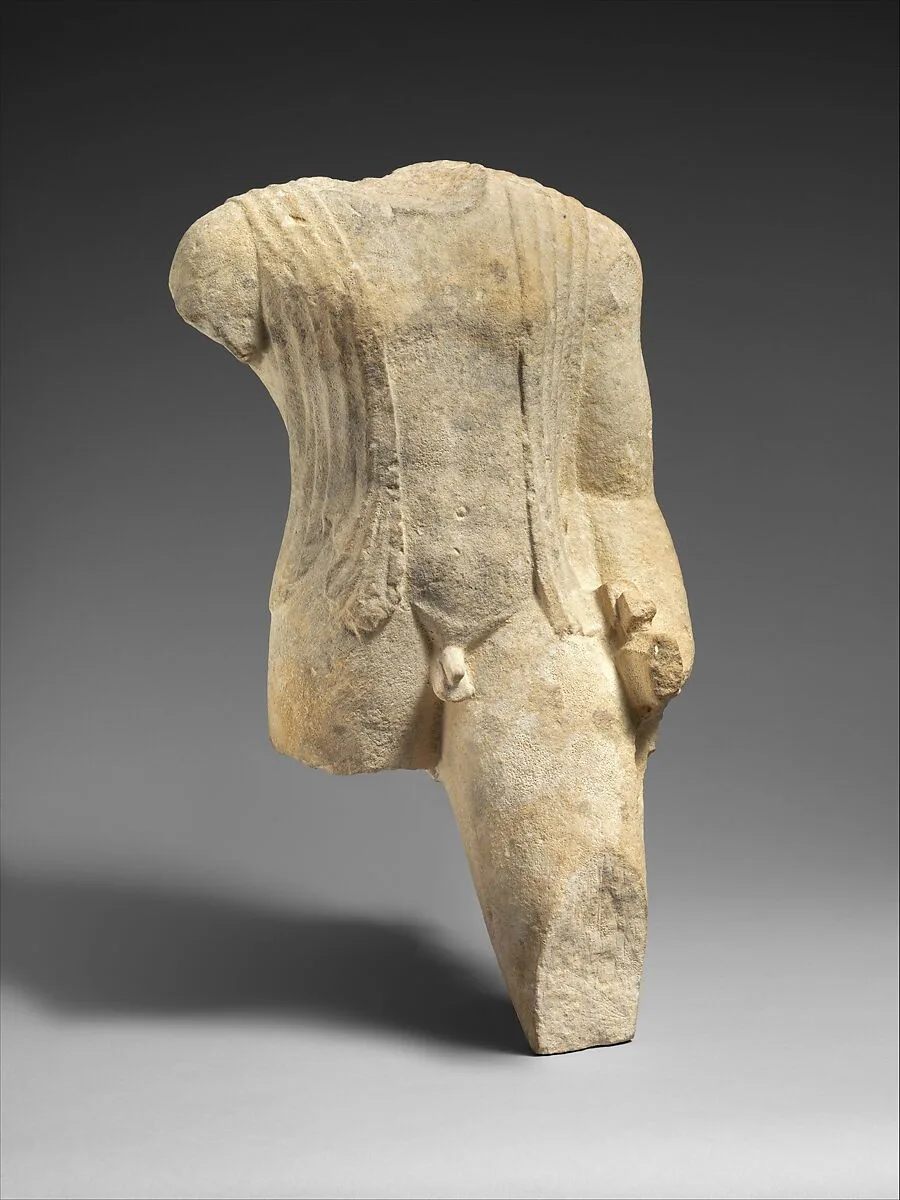 Limestone figure of a draped man — Unknown
