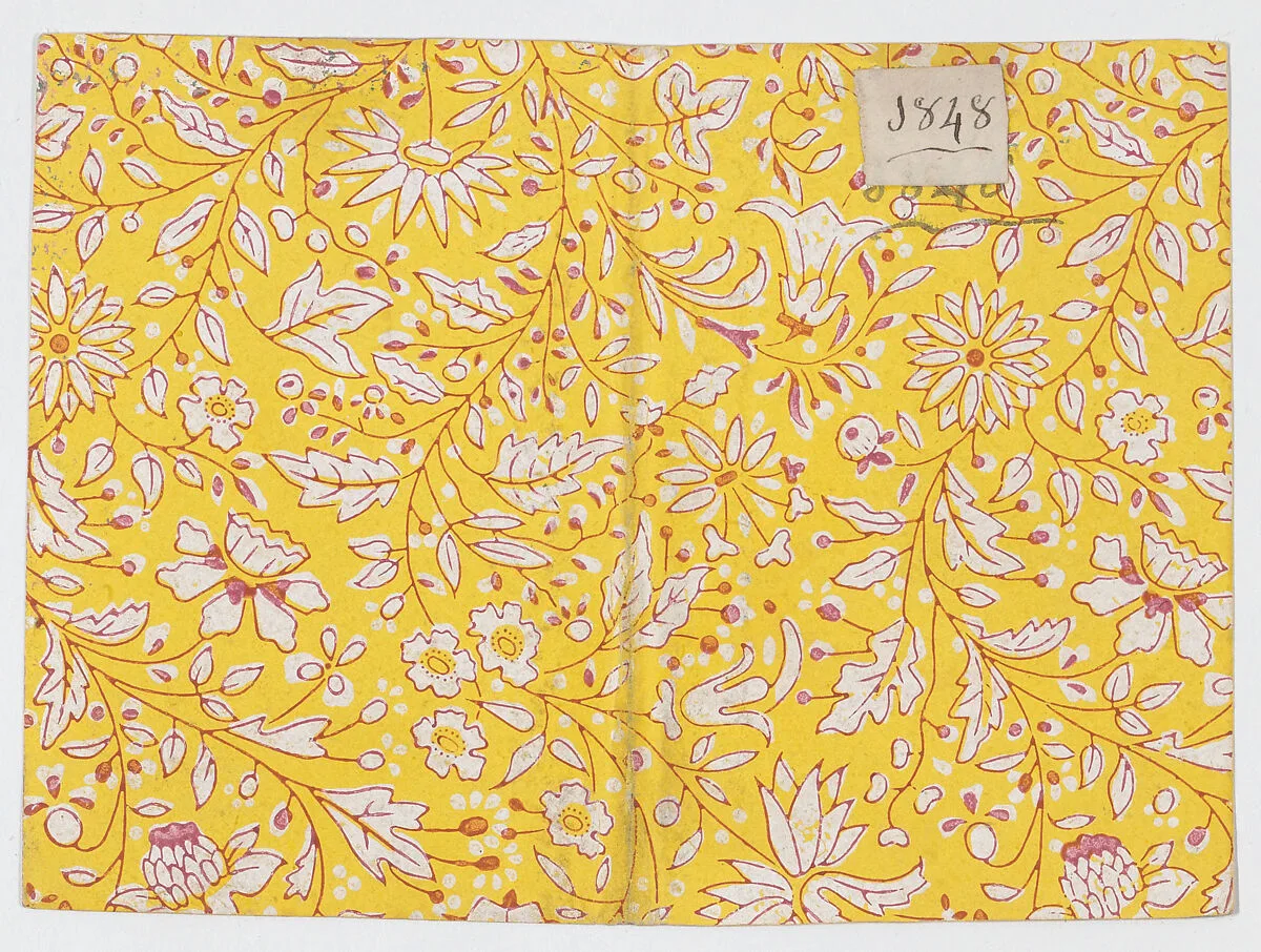 Yellow book cover with floral and vine pattern — Anonymous