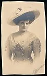 [Woman in Hat, Necklace, and Short Sleeved Gown]
