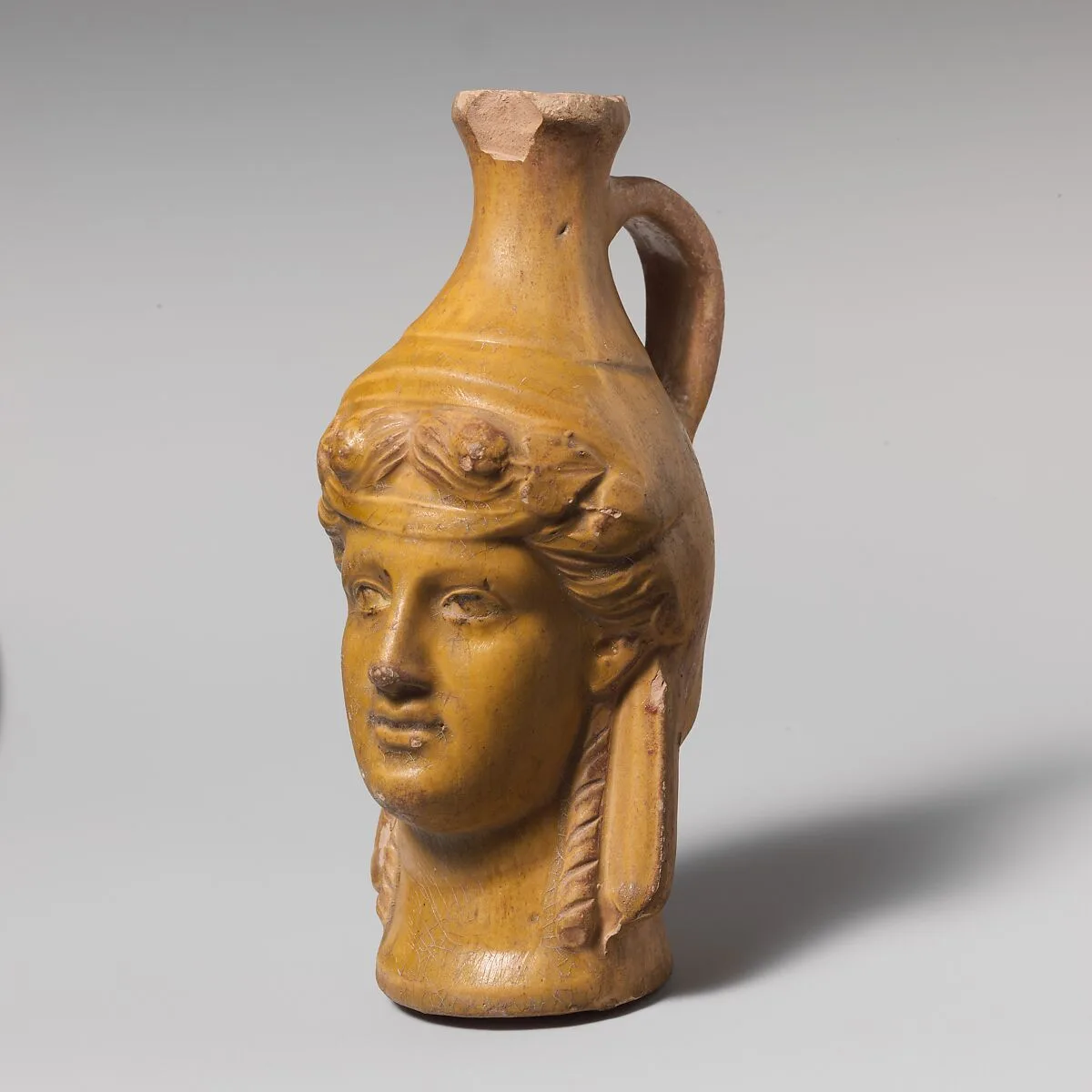 Terracotta jug in the form of Dionysos — Unknown