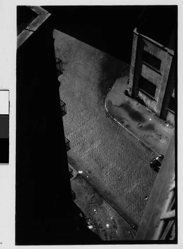 [Three 35mm Film Frames: View from Window of Corner Building and Cobblestone Street, Brooklyn?, New York]