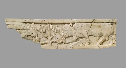 Furniture plaque carved in relief with bulls and tree
