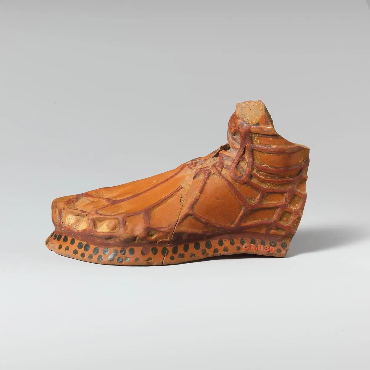 Terracotta aryballos in the form of a sandaled foot — Unknown