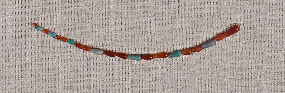 String of carnelian, beryl and steatite drop beads — Unknown