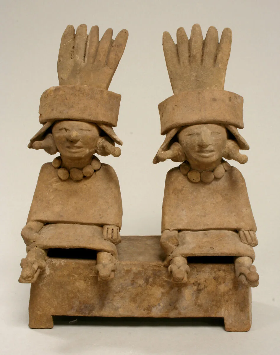 Two Ceramic Figures Seated on a Bench — Unknown