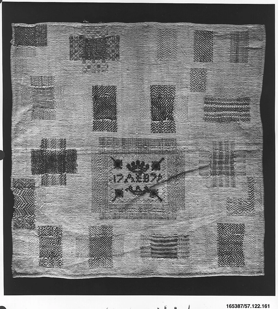 Embroidered darning sampler — Unknown