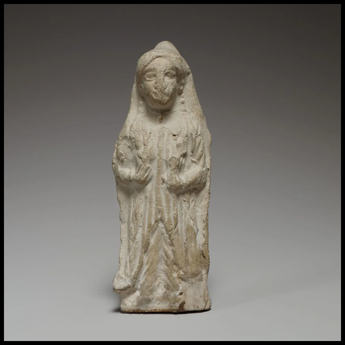 Standing female figurine — Unknown