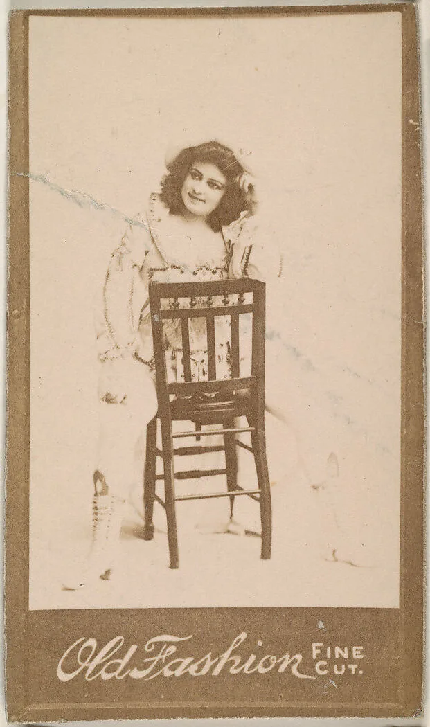 Actress straddling chair, from the Actresses series (N664) promoting Old Fashion Fine Cut Tobacco — Unknown