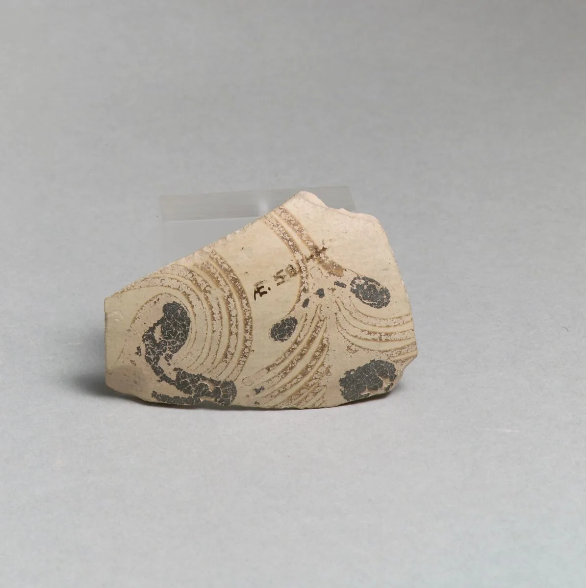 Terracotta vessel fragment with floral design — Unknown
