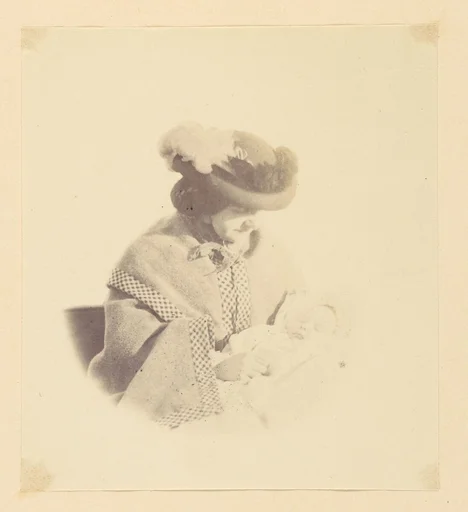 [Vignetted portrait, woman holding a baby]
