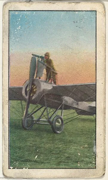 Card No. 191, New French Folding Aeroplane That Carries a Repeating Gun, from the World War I Scenes series (T121) issued by Sweet Caporal Cigarettes — American Tobacco Company|Underwood & Underwood