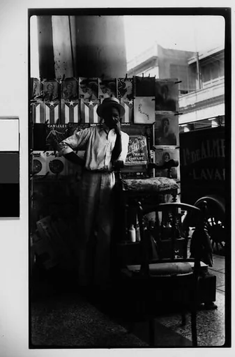 [Young Man in Front of Newspaper Kiosk, Havana]