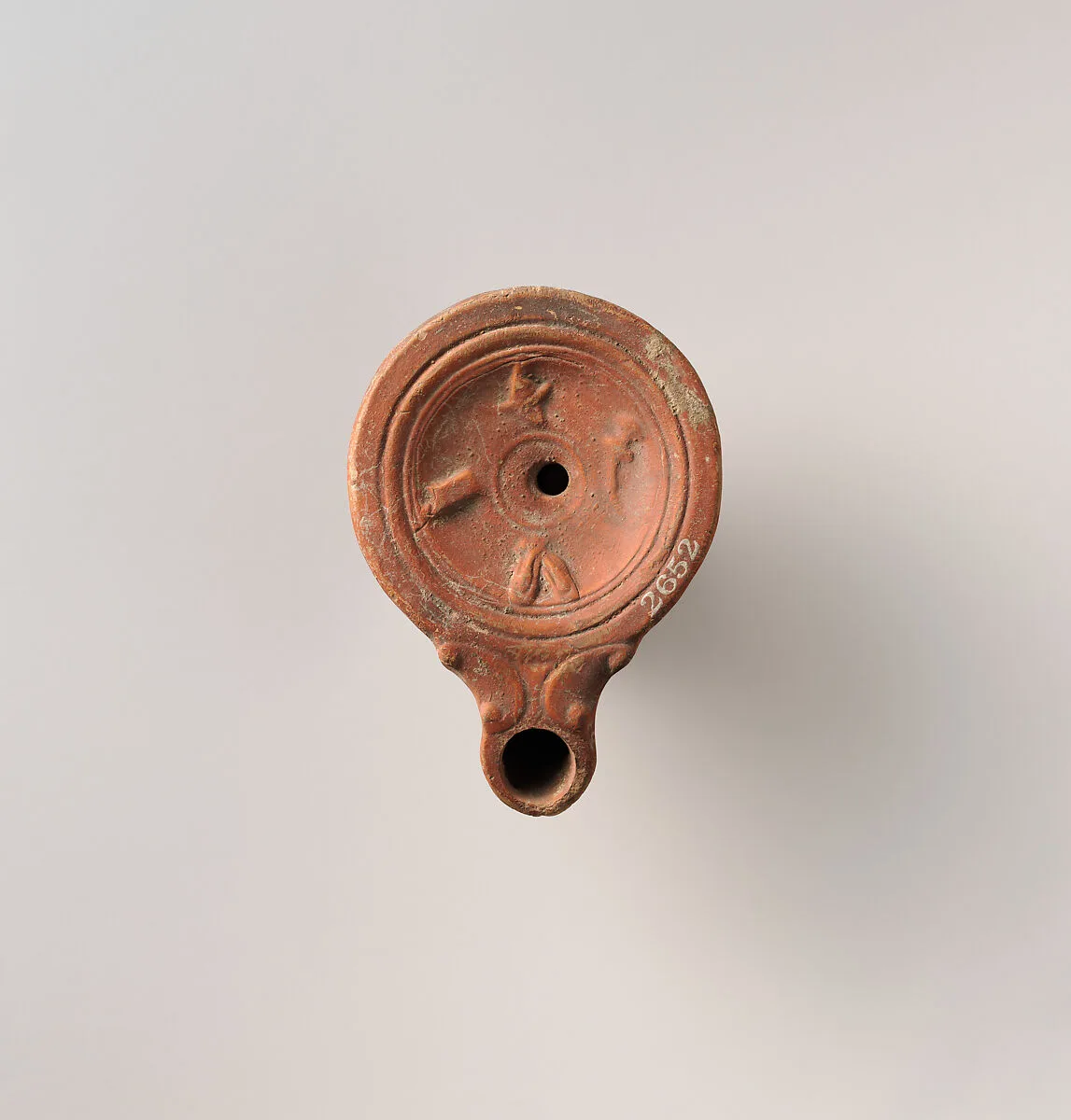 Terracotta oil lamp — Unknown