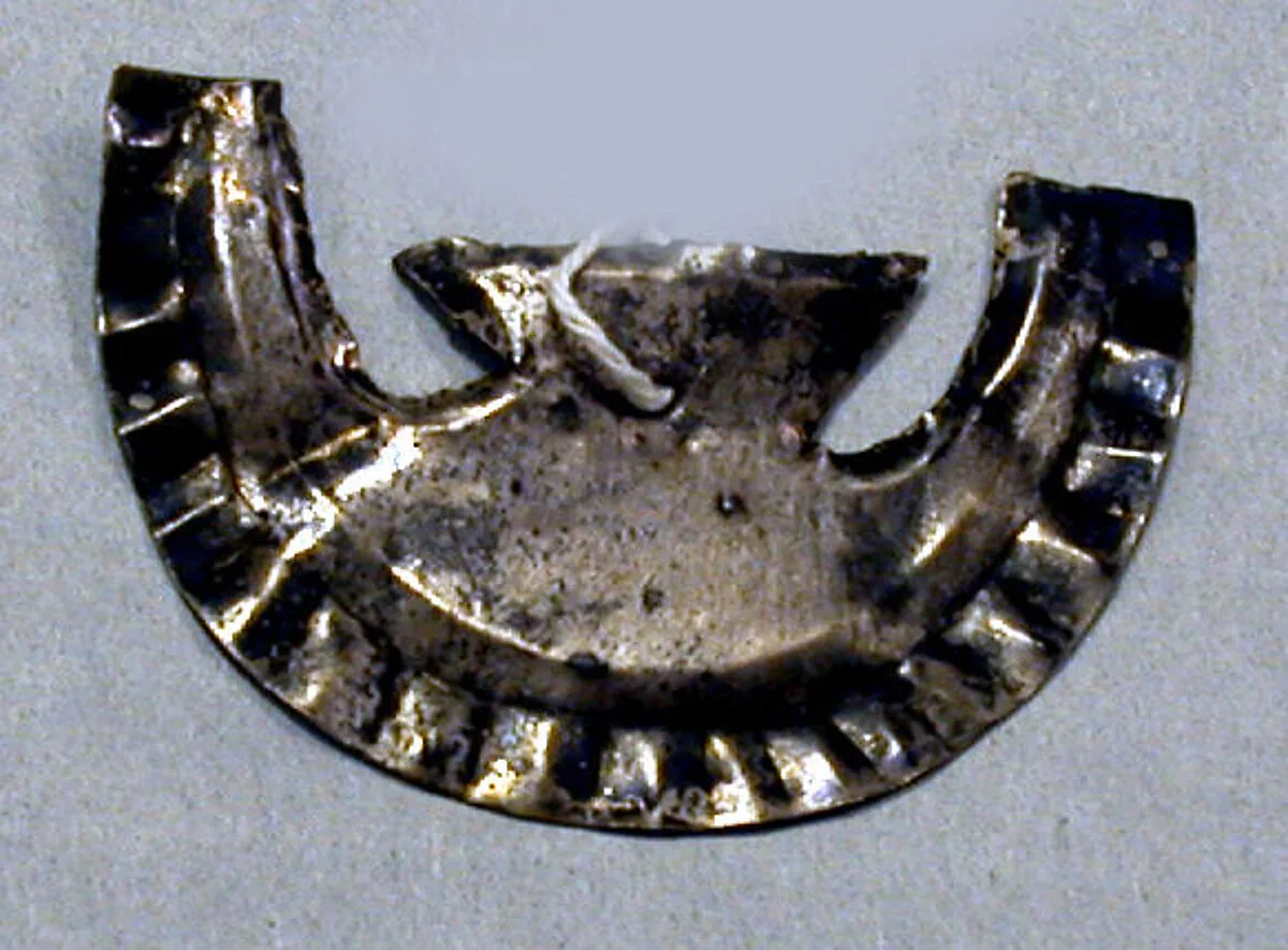 Hammered Silver Collar Ornament (?) — Unknown