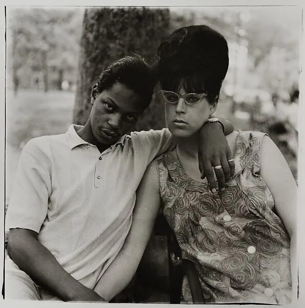 A young man and his pregnant wife in Washington Square Park, N.Y.C. — Diane Arbus|Neil Selkirk