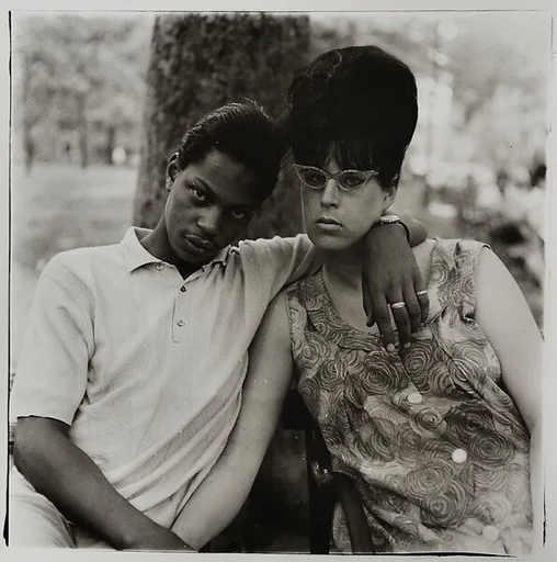 A young man and his pregnant wife in Washington Square Park, N.Y.C. 