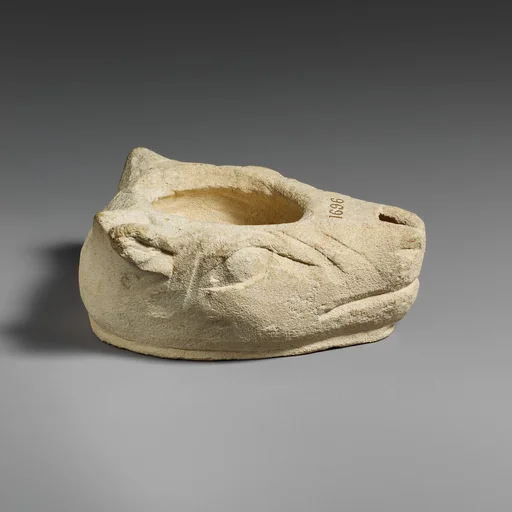 Limestone lamp in the shape of a bull’s head