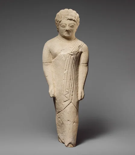 Limestone statuette of a beardless male votary in Greek dress