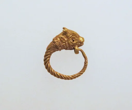 Gold earring with head of a bull