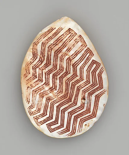 Engraved pearl shell