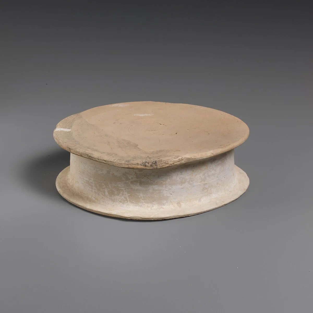 Terracotta statuette base — Unknown