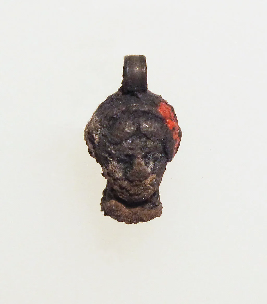 Silver pendant in the form of a woman's head — Unknown