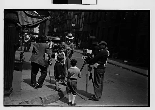 [Two 35mm Film Frames: Tintype Photographer and Group on Street Corner, New York City]