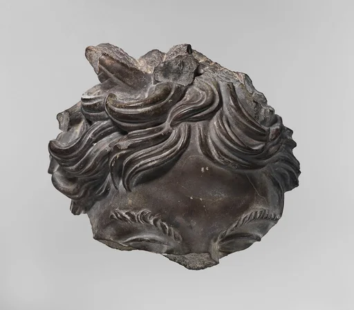 Greywacke head of a satyr