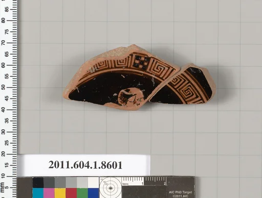 Terracotta fragment of a stemless kylix (drinking cup)