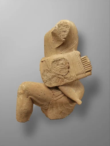 Limestone figure of kneeling Herakles