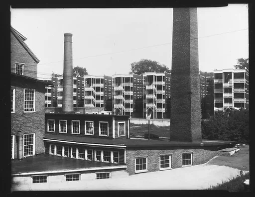 [Factory Buildings and Smokestacks in Front of Apartment Buildings, Windsor, Vermont]