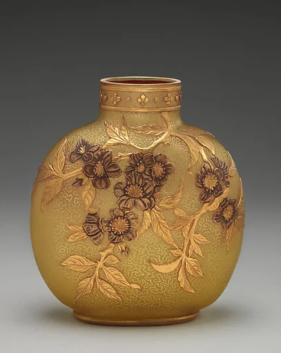 Vase decorated wtih apple tree bough
