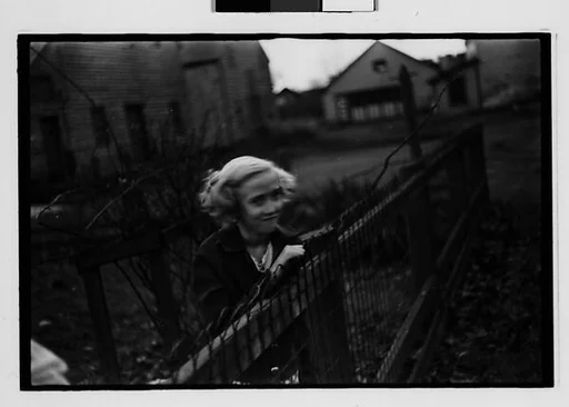 [Five 35mm Film Frames: Girl Leaning on Wire Fence in Yard, Vicinity Bethlehem, Pennsylvania]