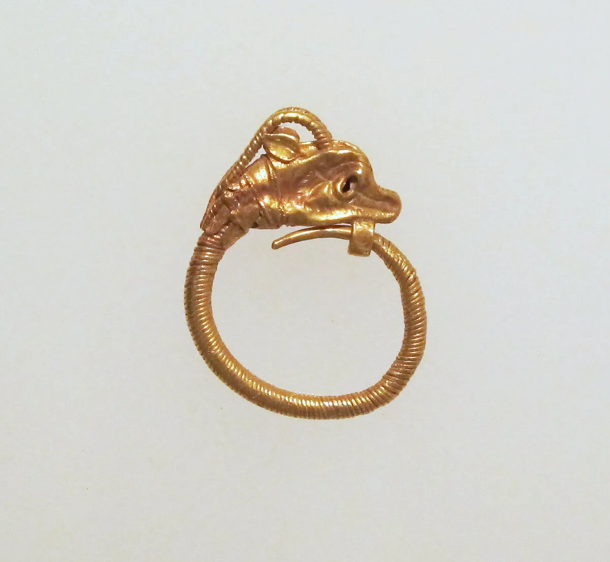 Gold earring with head of an antelope — Unknown