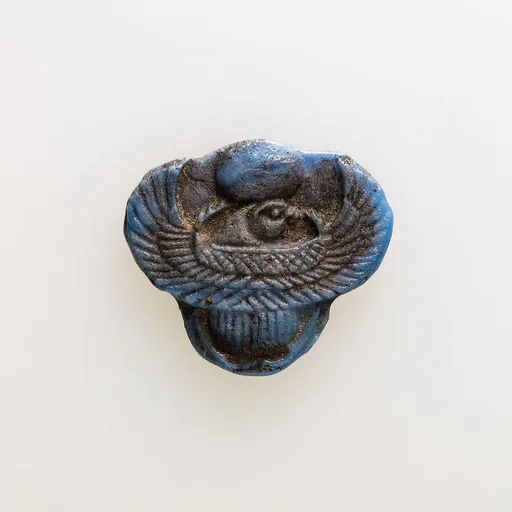 Amulet of winged scarab with falcon head
