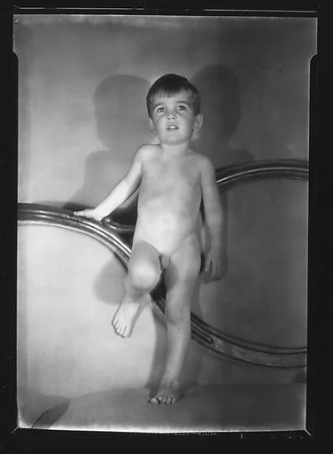 [Unidentified Naked Child Standing on Couch]