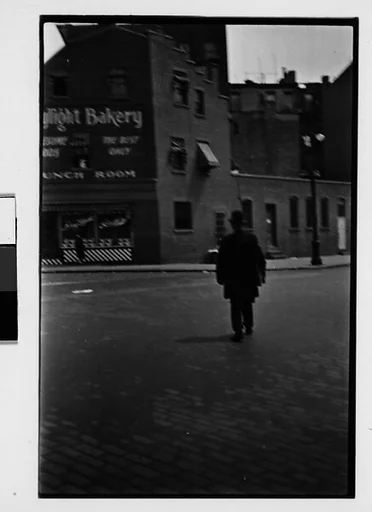 [Two 35mm Film Frames: Man in Bowler on Cobblestone Street, From Behind, New York City]