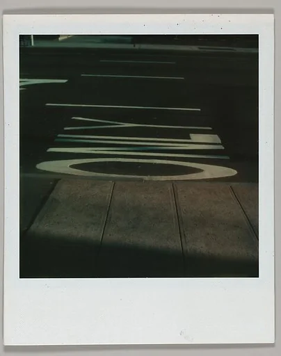 [View of Street Lettering and Arrows from Sidewalk]
