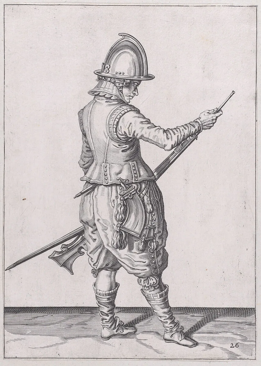 A soldier ramming home powder and bullet with the ramrod, from the Marksmen series, plate 26, in Waffenhandlung von den Rören Musquetten undt Spiessen / Wapenhandelinghe van Roers Musquetten ende Spiessen (The Exercise of Arms) — Jacques de Gheyn II|Jacques de Gheyn II|Robert Willemsz de Baudous