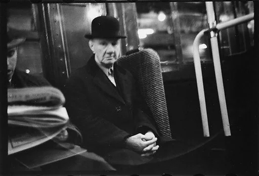 [Four 35mm Film Frames: Subway Passengers, New York City: Man in Bowler Hat, Man Reading Newspaper, Elderly Woman, Male Standee]