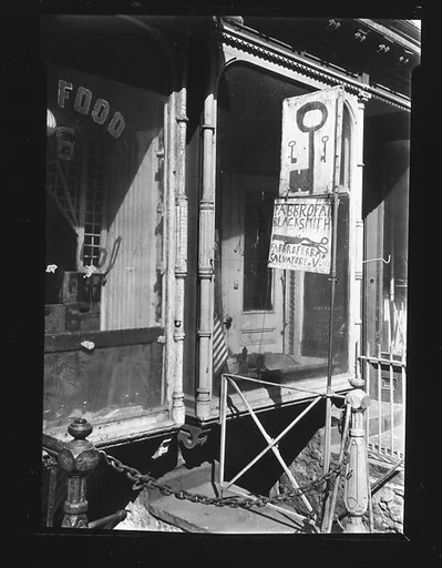 [Shopfront Façade with Painted Locksmith and Blacksmith Signs, No. 8 Stanton Street, New York City]