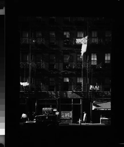 [Apartment Building with Ground Floor Shops and Parked Cars in Front, 41-43 Carmine Street, New York City]