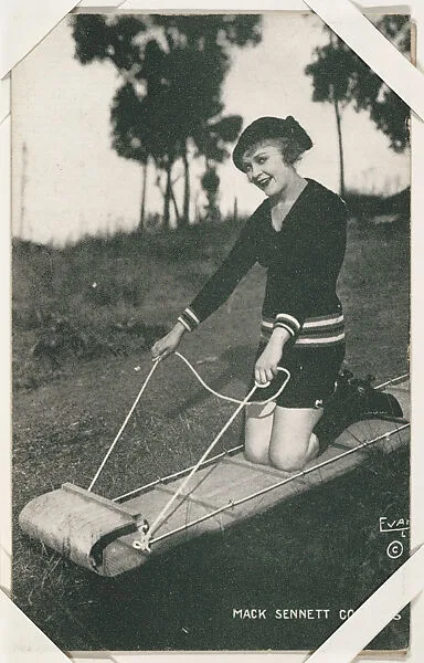 Actress Phyllis Haver kneeling on sled from Mack Sennett Comedies Arcade series (W423) — Unknown