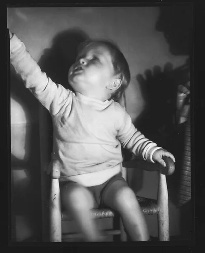 [Baby in High Chair]