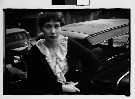 [Jane Ninas in Front of Parked Cars in French Quarter, New Orleans, Louisiana]
