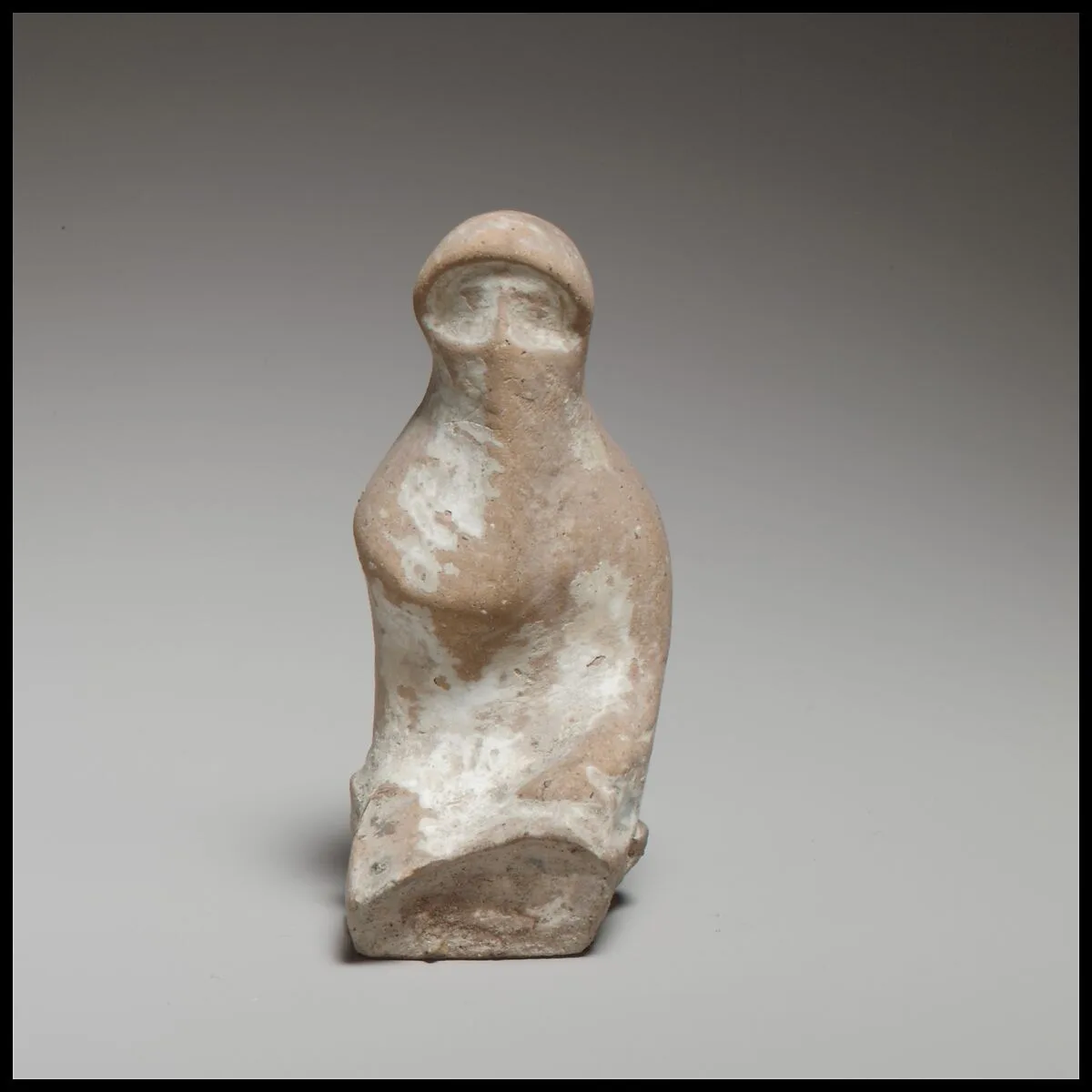 Terracotta seated veiled woman — Unknown