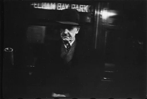 [Three 35mm Film Frames: Subway Passengers, New York City:  Elderly Man in Hat Beneath "City Hall" Sign]
